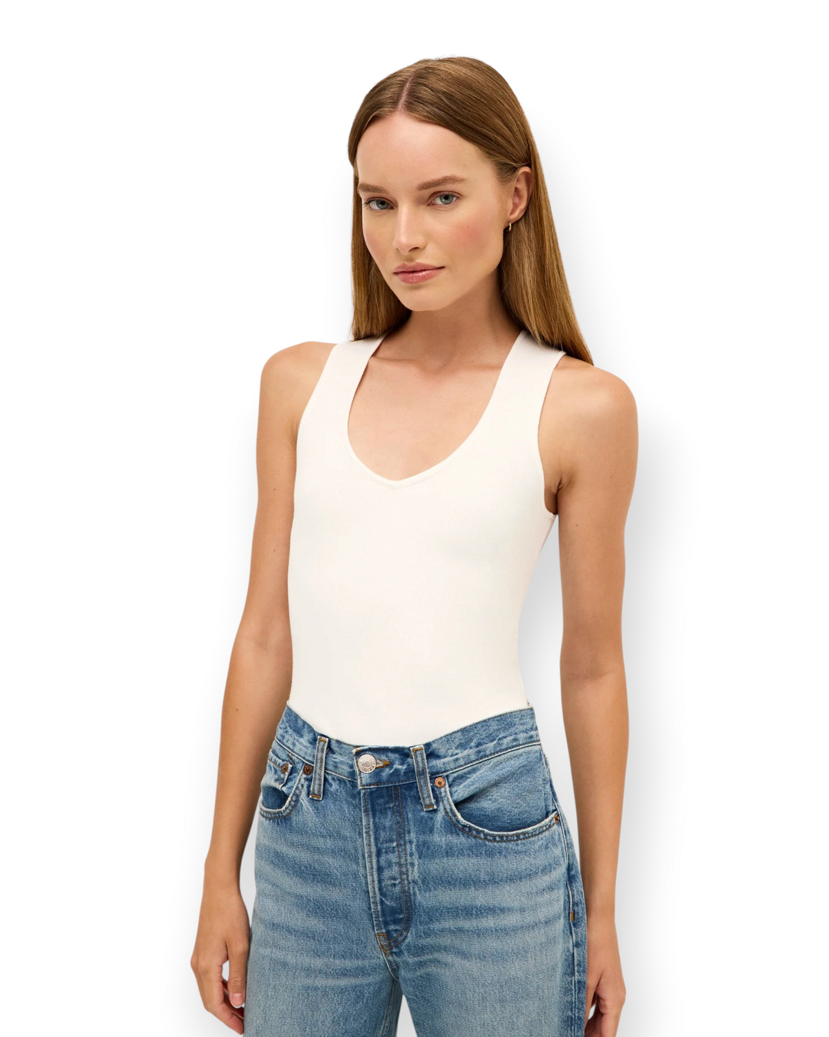 Birdie by Nina Liddle Design Miranda tank in white ribbed knit worn by a model with blue denim jeans