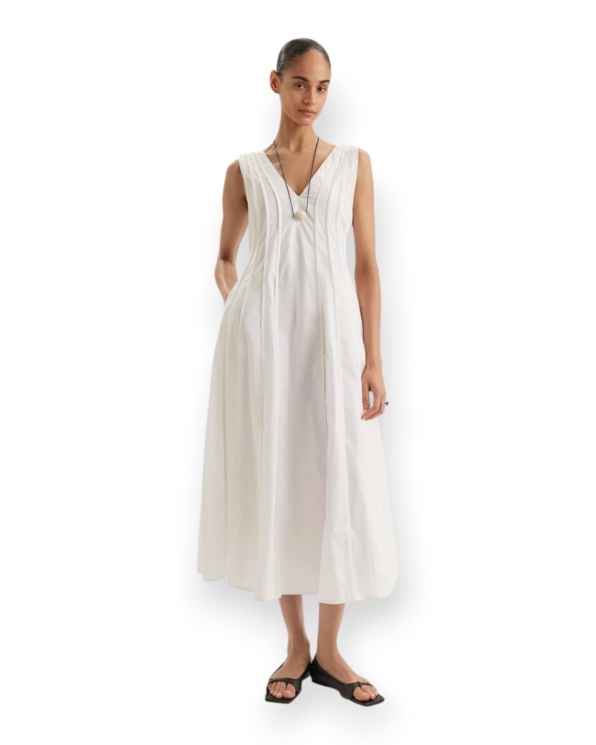 Birdie by Nina Liddle Design white sleeveless Pima cotton tea-length Raas dress with seam binding and side pockets.