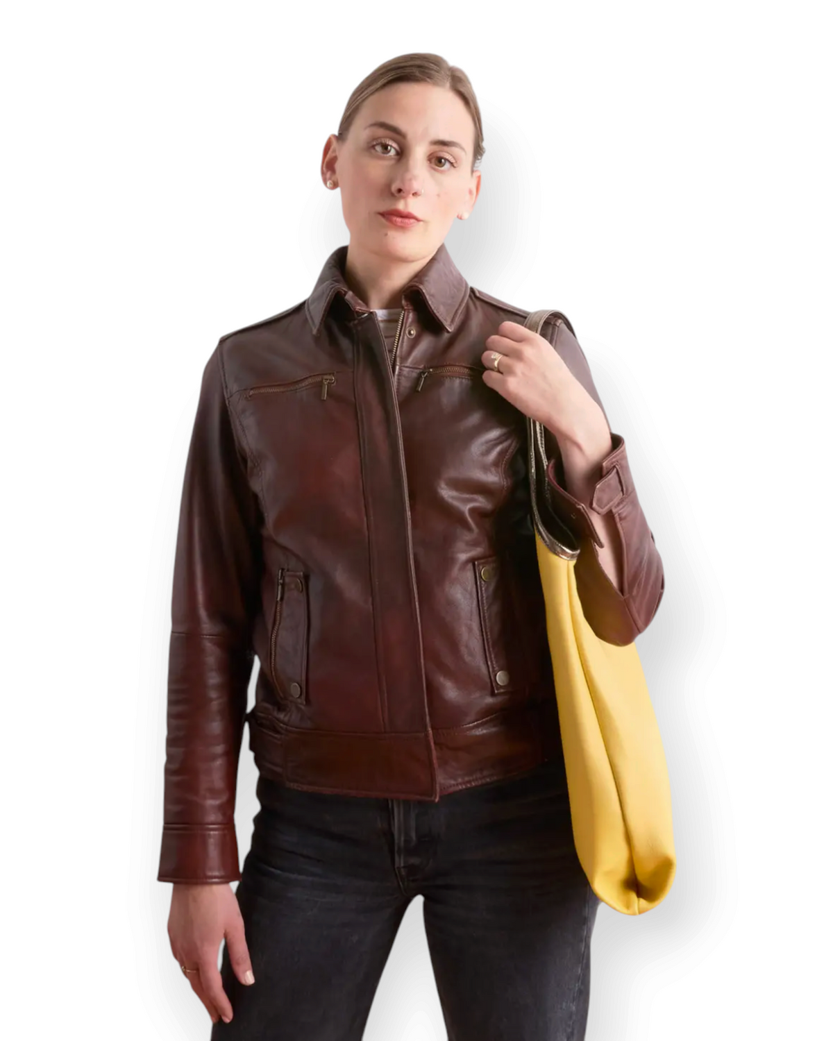 Birdie by Nina Liddle Design yellow leather envelope tote bag carried over the shoulder by a woman in a leather jacket