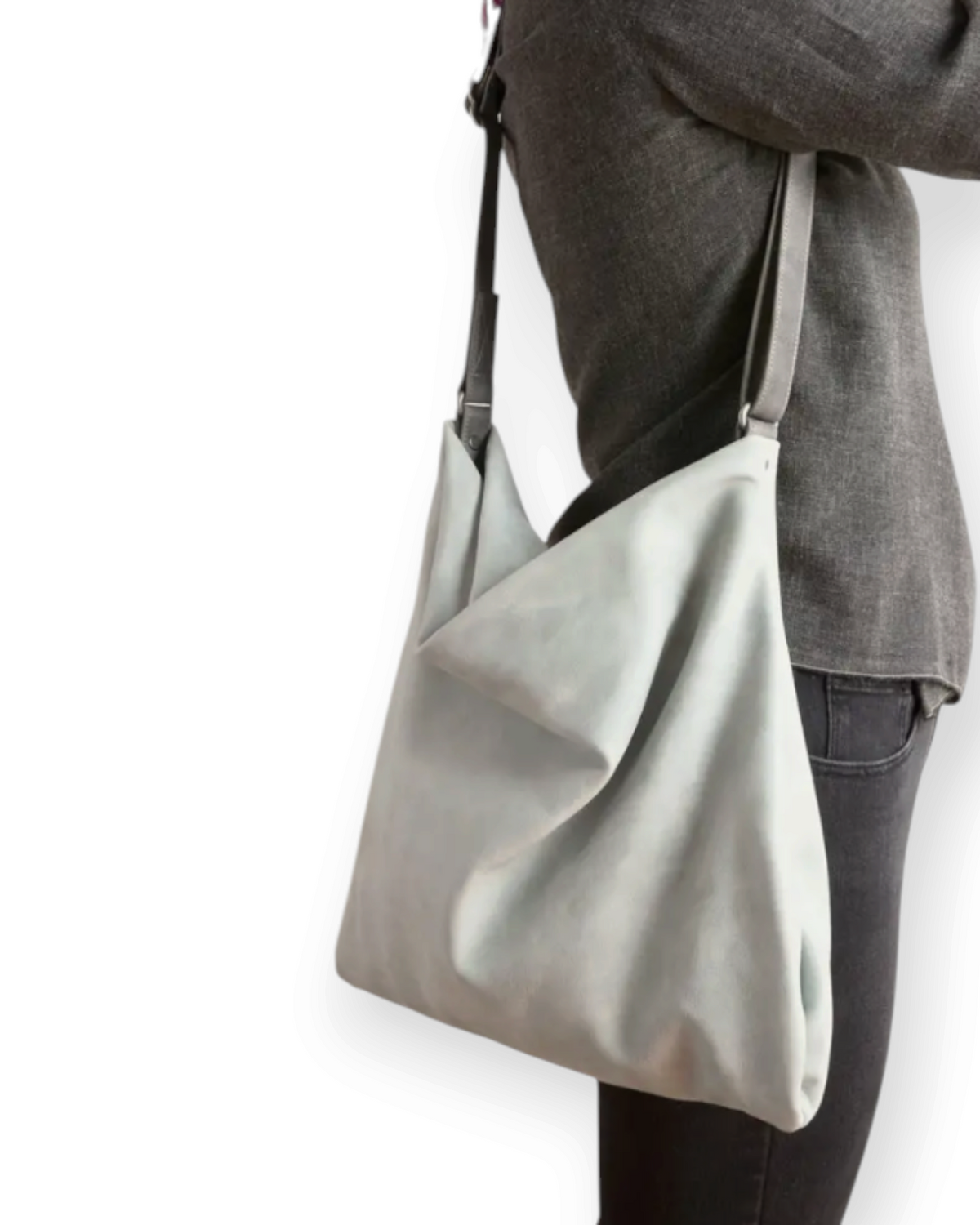 Birdie by Nina Liddle Design Olivia crossbody bag in light grey worn over the shoulder with an adjustable strap