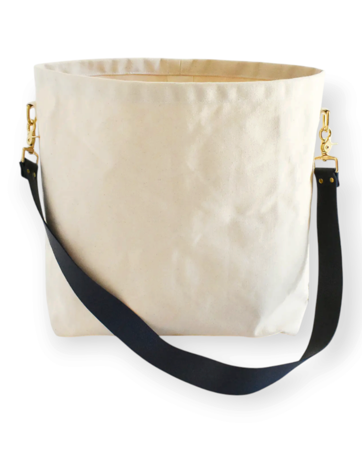 Birdie by Nina Liddle Design canvas tote bag with a detachable black leather strap and gold hardware.