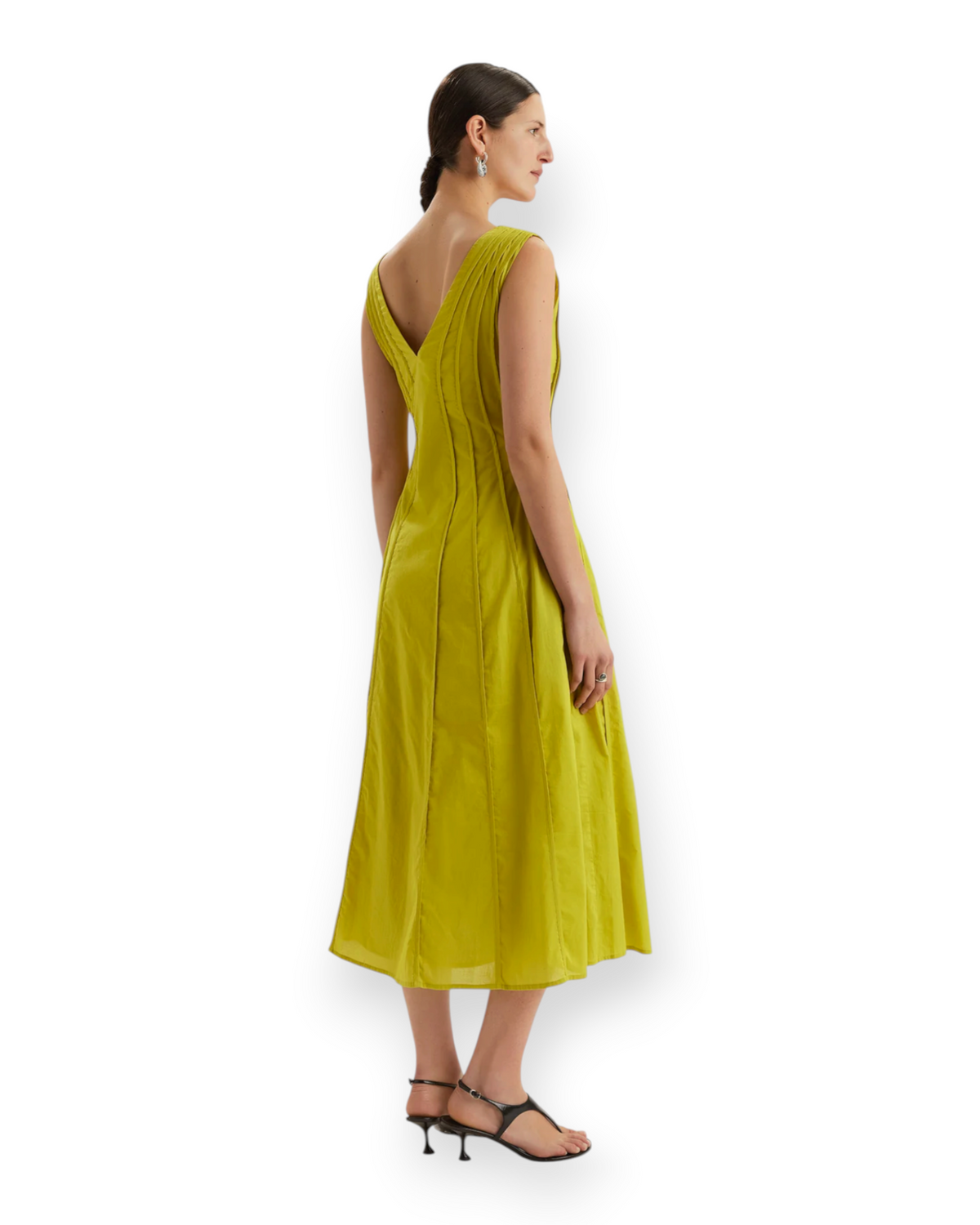 Model wearing a lime green Birdie by Nina Liddle Design Raas Dress in Pima cotton lawn with a tea-length silhouette.