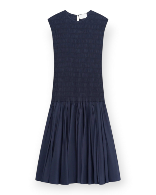 Birdie by Nina Liddle Design navy blue cotton voile Stijl dress with a smocked bodice and gathered skirt.