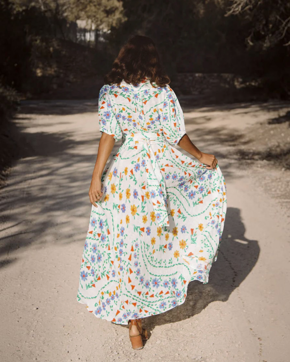 Birdie by Nina Liddle Design Bea ankle dress in white cotton linen with a colorful floral print and sash belt