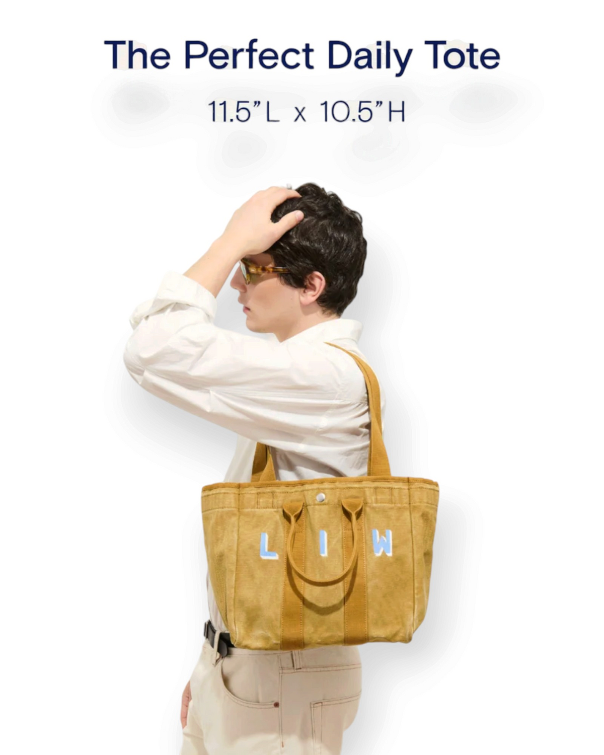 Birdie by Nina Liddle Design garment-washed cotton tote bag in mustard yellow with LIW lettering and double handles.