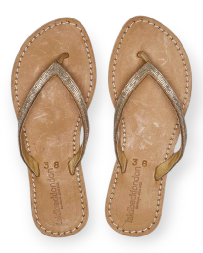 Birdie by Nina Liddle Design Seri flat leather flip flops with beaded toe post straps and cushioned EVA outsoles.
