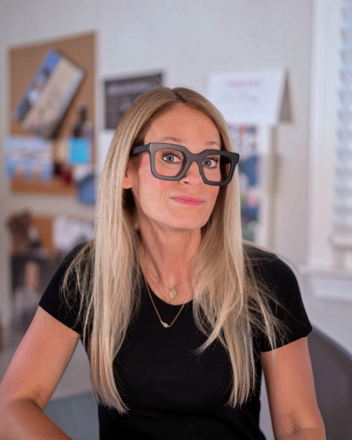 Birdie by Nina Liddle Design Nora oversized black reading glasses worn by a blonde woman with a wide fit frame