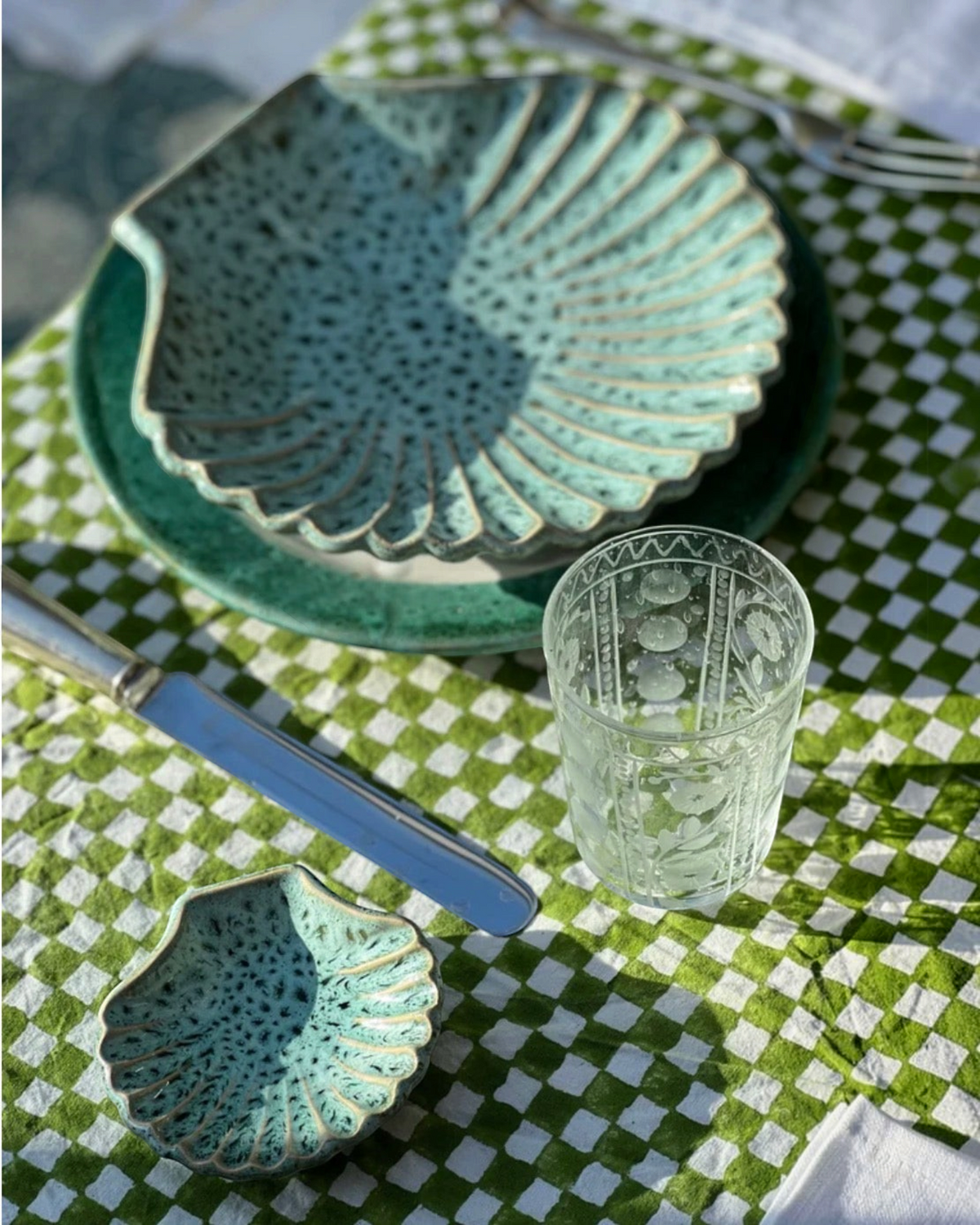 Birdie by Nina Liddle Design set of 6 clear hand-blown etched juice glasses on a green and white checkered tablecloth