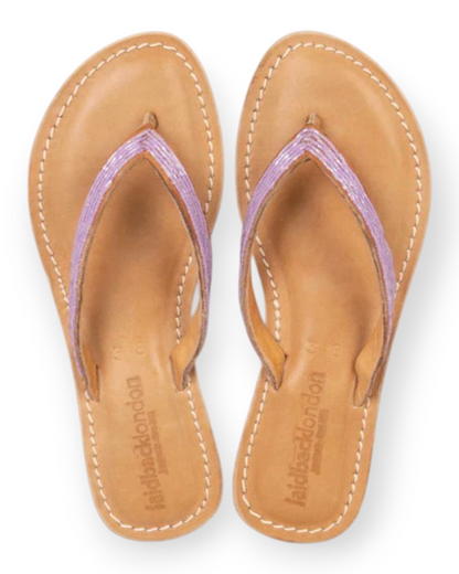 Birdie by Nina Liddle Design Seri flat leather flip flops with lavender beaded toe post and cushioned EVA outsole