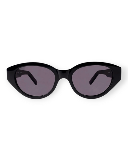 Birdie by Nina Liddle Design Reese sunglasses featuring a bold black oval acetate frame and dark tinted lenses.
