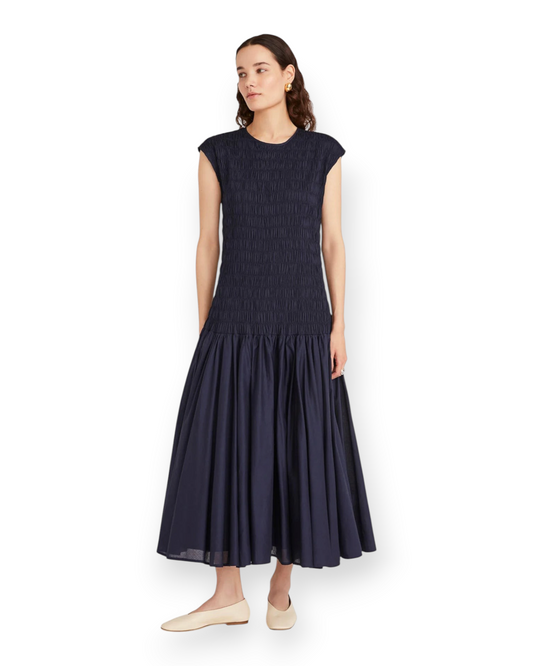 Birdie by Nina Liddle Design Stijl dress in navy cotton voile with a smocked bodice, capped sleeves, and midi skirt.