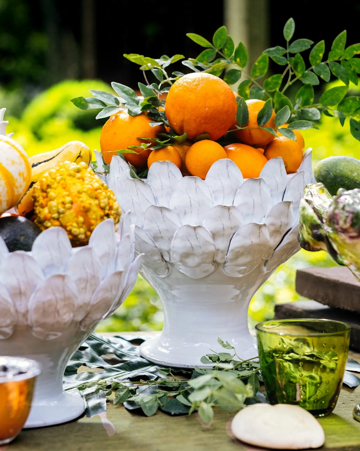 Birdie by Nina Liddle Design small white artichoke footed centerpiece bowl filled with fresh oranges on a table