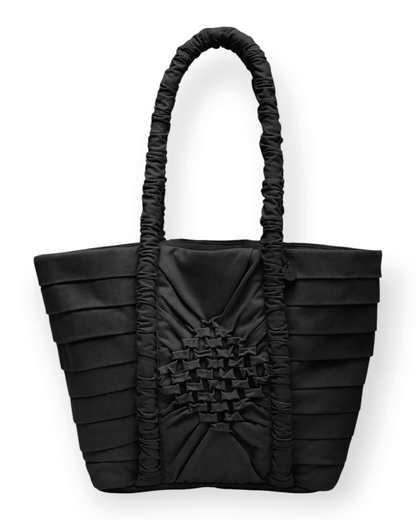 Birdie by Nina Liddle Design black cotton twill Miren bag with geometric smocking and a ruched handle.