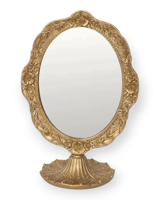 Birdie by Nina Liddle Design vintage oval makeup mirror with an ornate gold resin frame featuring floral carvings
