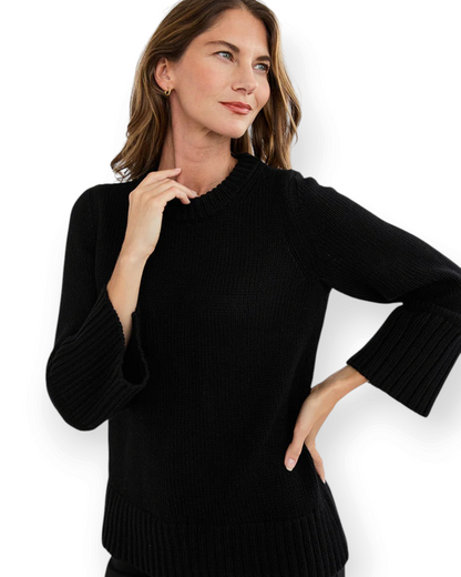 Model wearing Birdie by Nina Liddle Design black Turkish cotton crewneck sweater with flared bell sleeves.