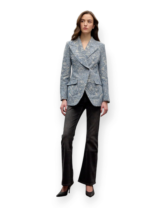 Model wearing a Birdie by Nina Liddle Design blue floral jacquard single-breasted blazer with structured shoulders.