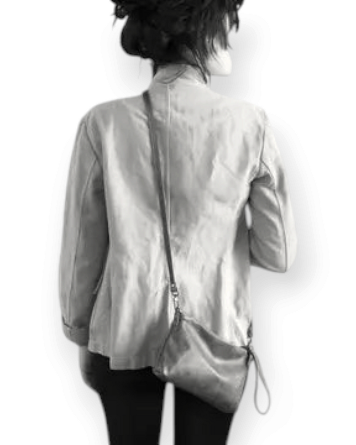 Birdie by Nina Liddle Design Pinched bottom Traveller Small leather crossbody bag worn by a woman from behind