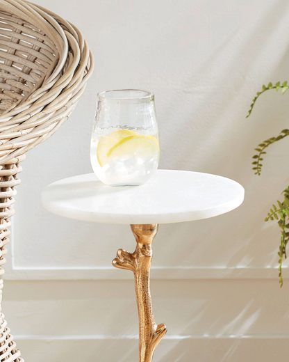 Birdie by Nina Liddle Design Varina accent table with a white marble top and gold cast-aluminum vine-shaped base.