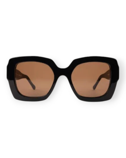 Birdie by Nina Liddle Design Ann oversized black sunglasses with brown tinted lenses and a wide fit frame.