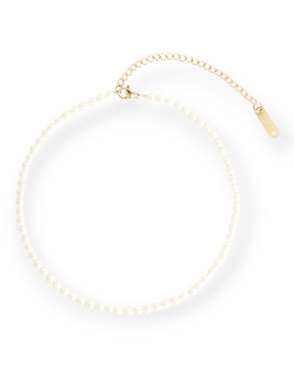 Birdie by Nina Liddle Design Augusta pearl choker featuring ivory glass beads on a 14k gold-plated chain with extender