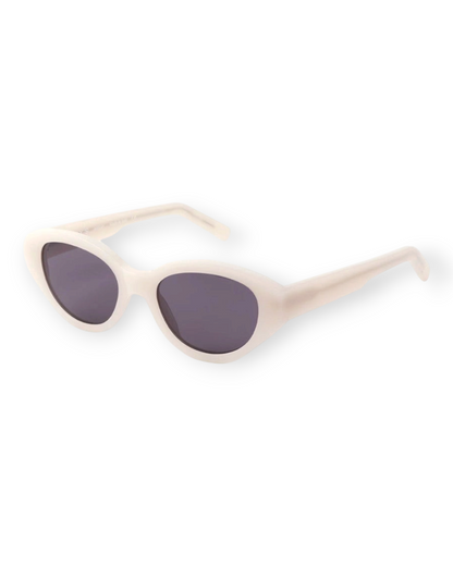 Birdie by Nina Liddle Design Reese oval sunglasses in cream biodegradable Italian acetate with dark tinted lenses.