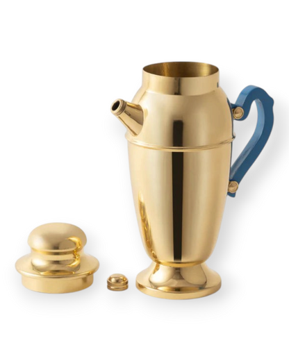 Birdie by Nina Liddle Design polished brass cocktail shaker with a blue resin handle and matching lid