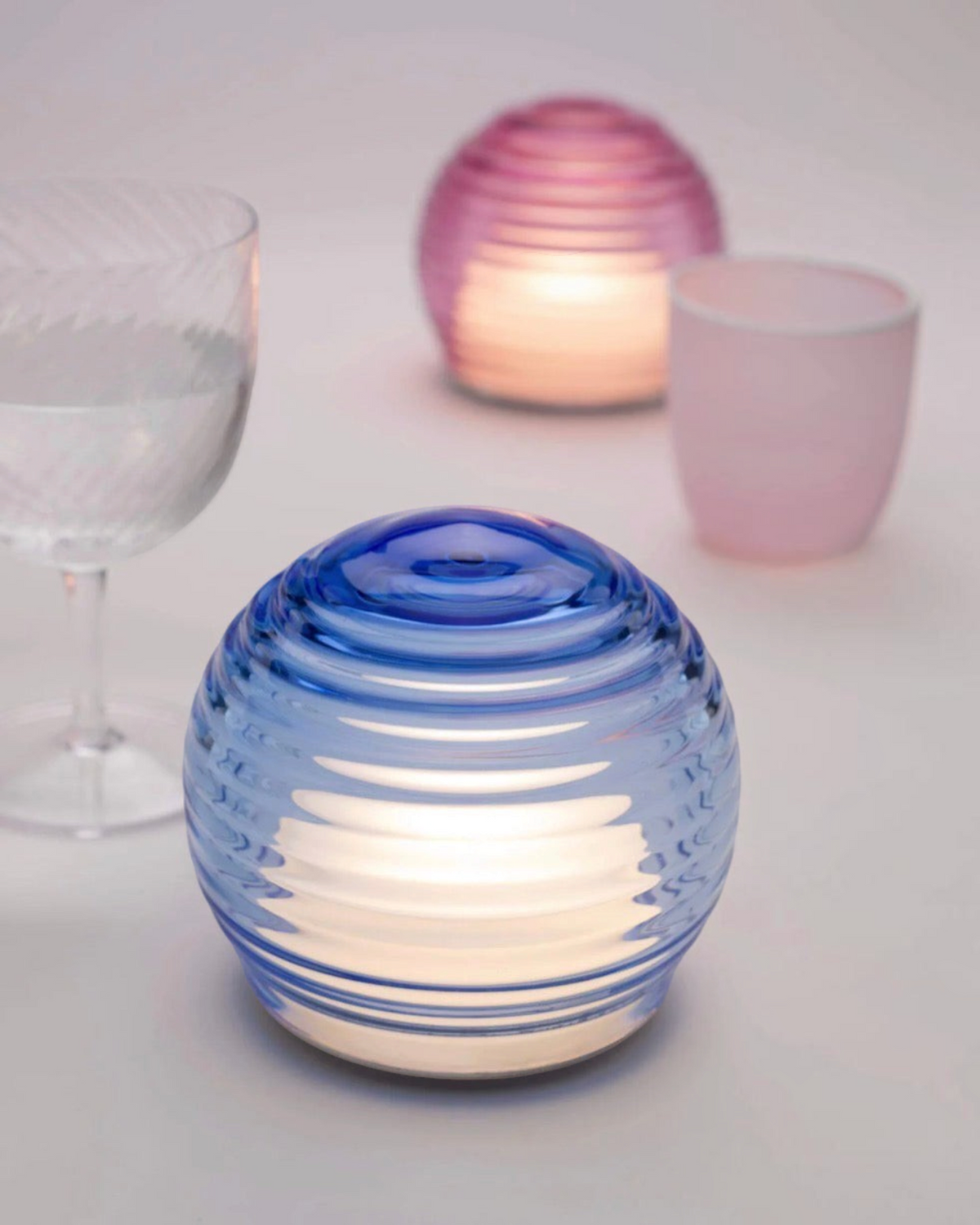 Birdie by Nina Liddle Design handblown blue Murano glass portable LED table light with concentric ring texture.