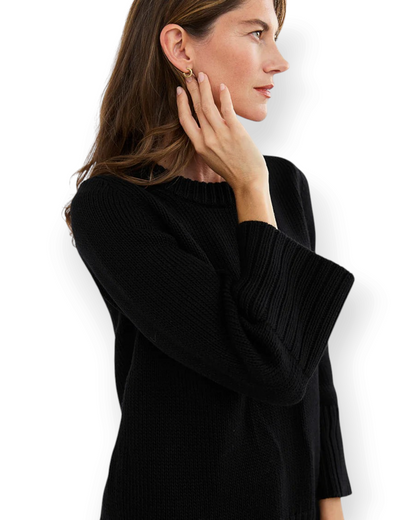 Birdie by Nina Liddle Design black Kittery crewneck sweater with bell sleeves and ribbed trim on a model