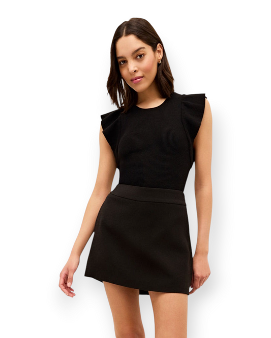 Birdie by Nina Liddle Design Rory top in black with a ribbed bodice and feminine ruffle sleeves worn with a skirt