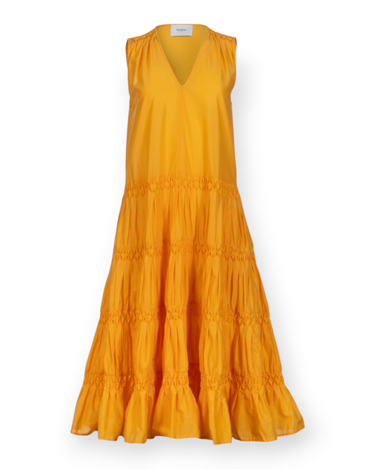 Birdie by Nina Liddle Design Wallis midi dress in mustard yellow Pima cotton lawn with a V-neck and tiered skirt.