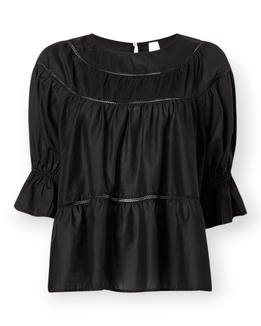 Birdie by Nina Liddle Design Sol blouse in black Pima cotton with crochet lace trim and puff sleeves.