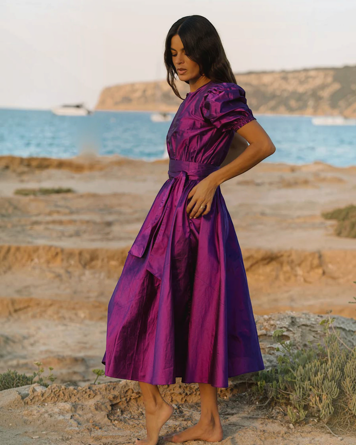 Birdie by Nina Liddle Design Brooke midi dress in purple silk taffeta with pleated cap sleeves and matching sash belt