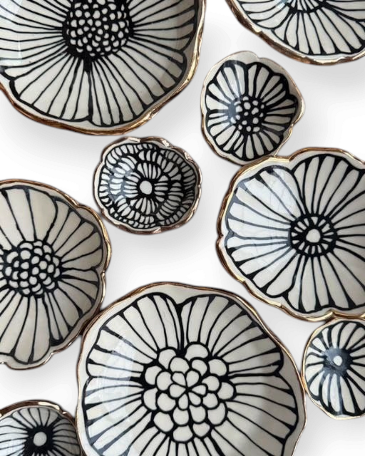 Birdie by Nina Liddle Design handmade stoneware flower jewelry dishes with black floral patterns and 22kt gold rims.