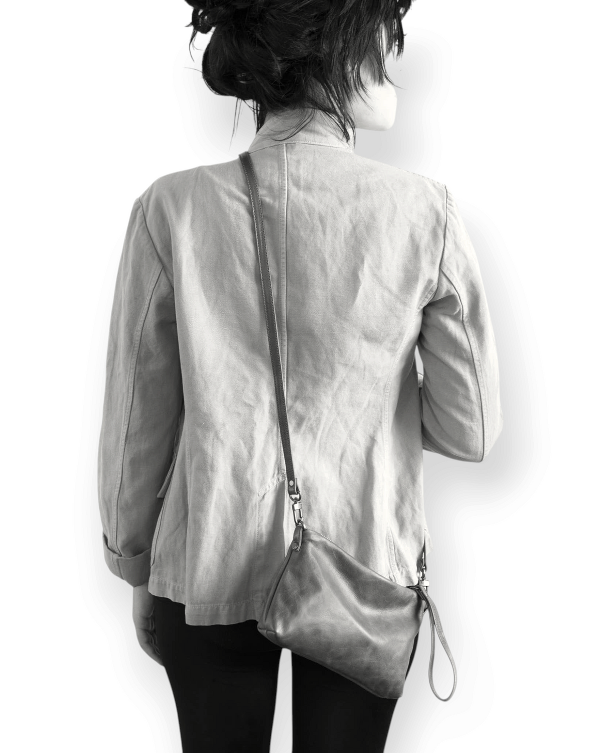 Birdie by Nina Liddle Design Pinched Bottom Traveler small crossbody bag with antique silver hardware on a model