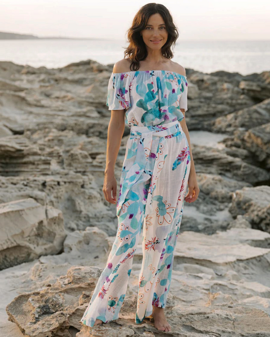 Birdie by Nina Liddle Design Dani jumpsuit in white cotton linen with blue and orange floral print and sash belt