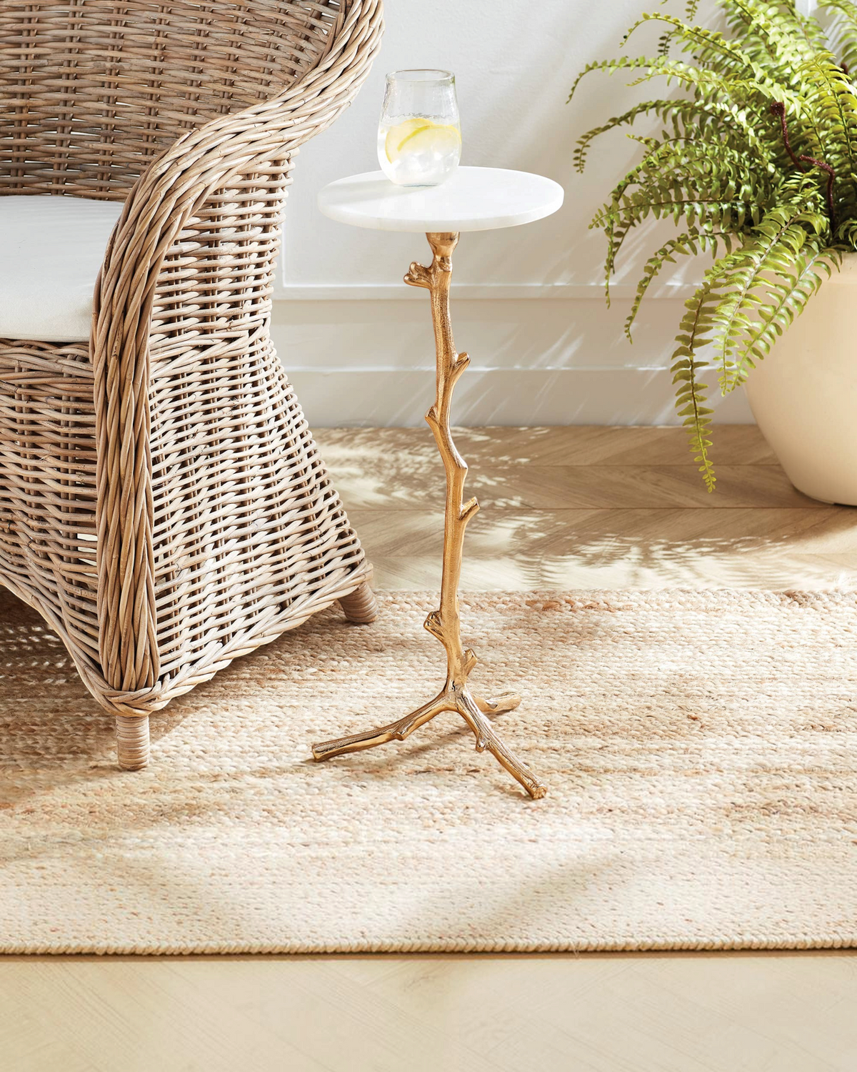 Birdie by Nina Liddle Design Varina accent table with a white marble top and gold vine-shaped cast-aluminum base.